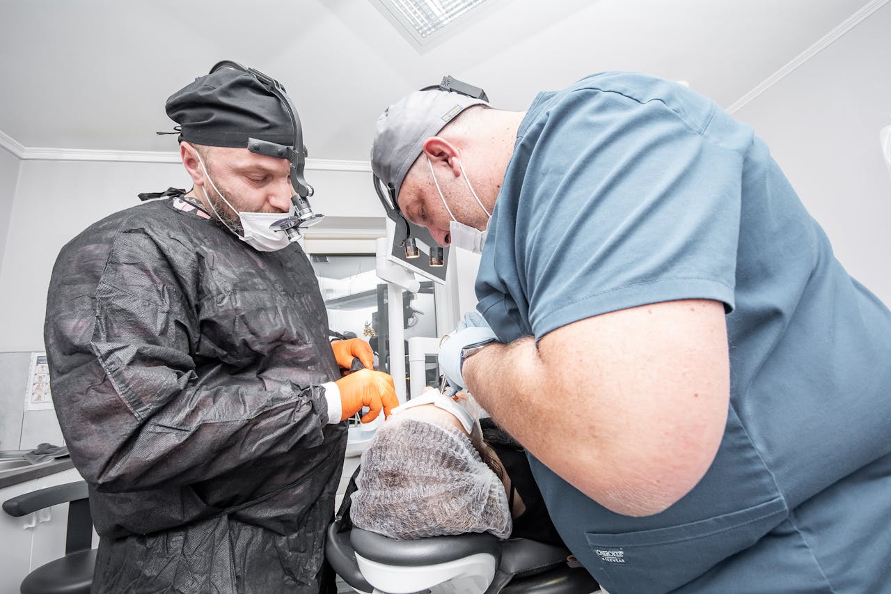 A dental surgery team carrying out treatment in a modern clinic